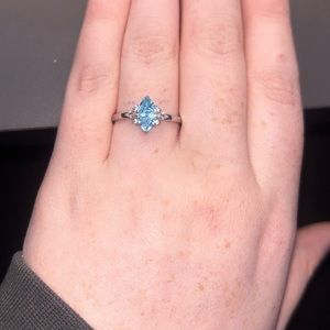 silver ring with blue gem